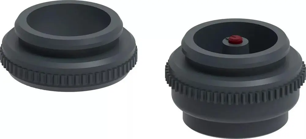 Schwarzer Adapter mit gewelltem Rand und zentralem Ansteckmechanismus. Produkt von Uponor zur Verwendung in verschiedenen Anwendungen.